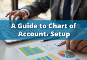 Chart of Accounts setup - bookkeeper at desk with image ovelay text showing a guide to chart of accounts setup